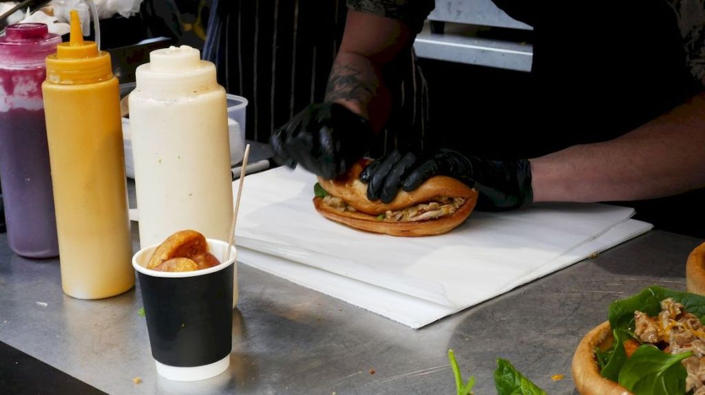 Finishing the Yorkshire Burrito - rolling it up. Then it is sealed in a sandwich toaster.