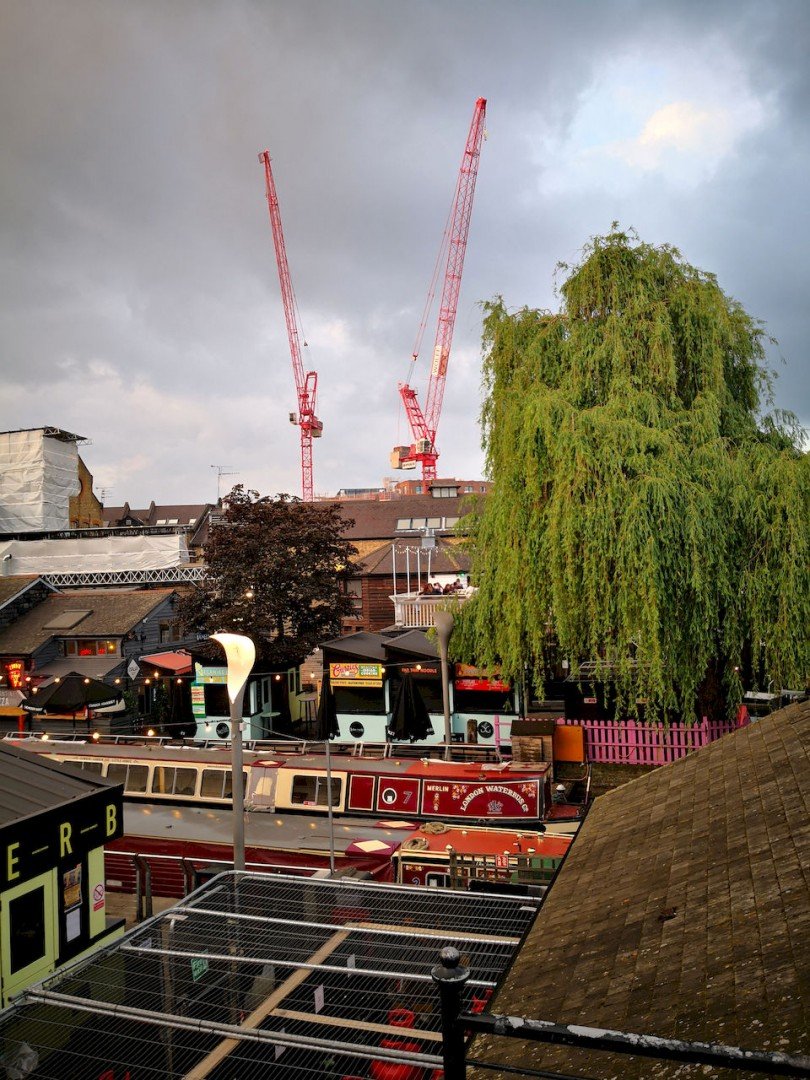 Cranes and narrow boats in the sundown light at Camden Market.